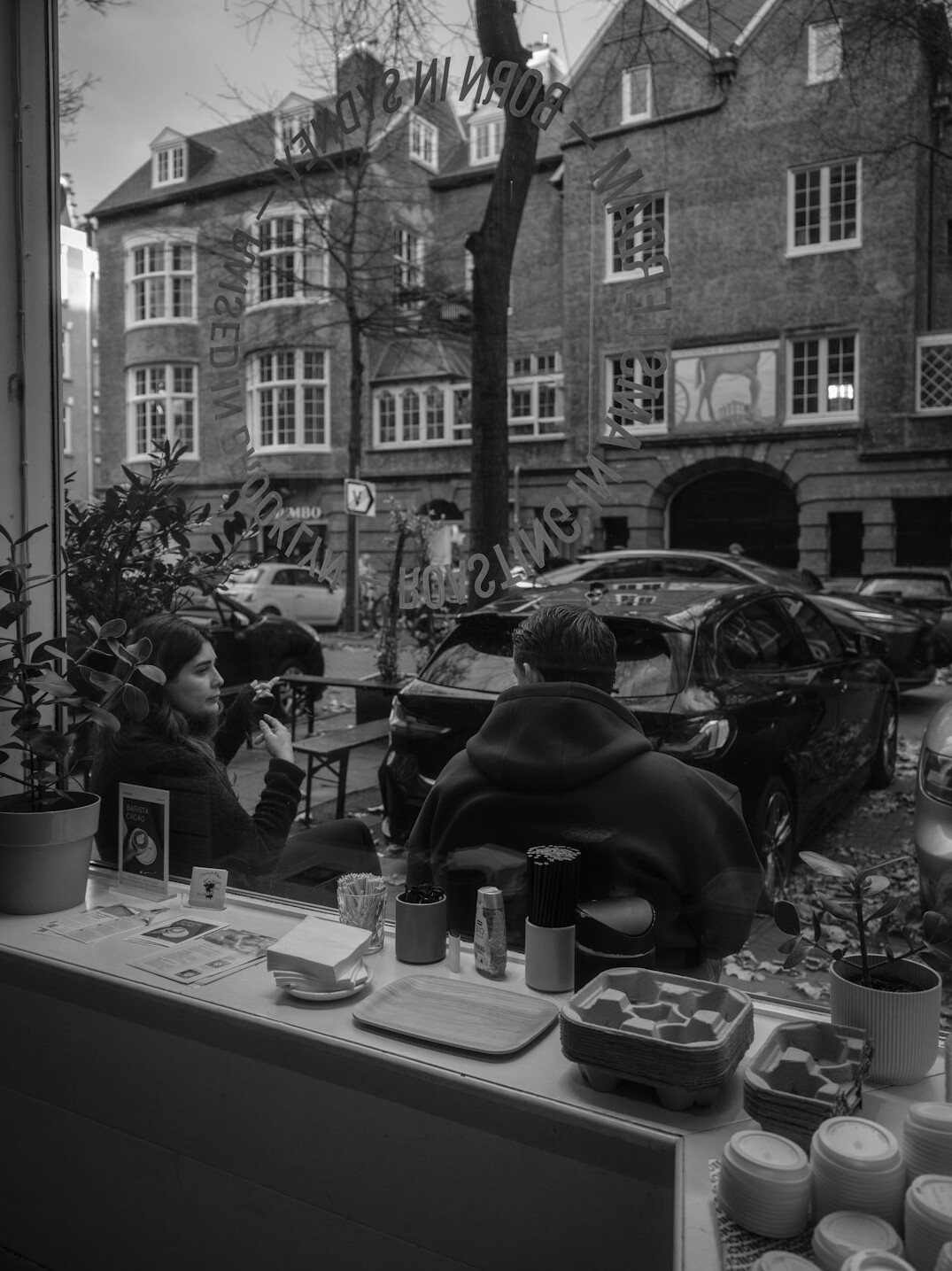 person drinking coffee on street