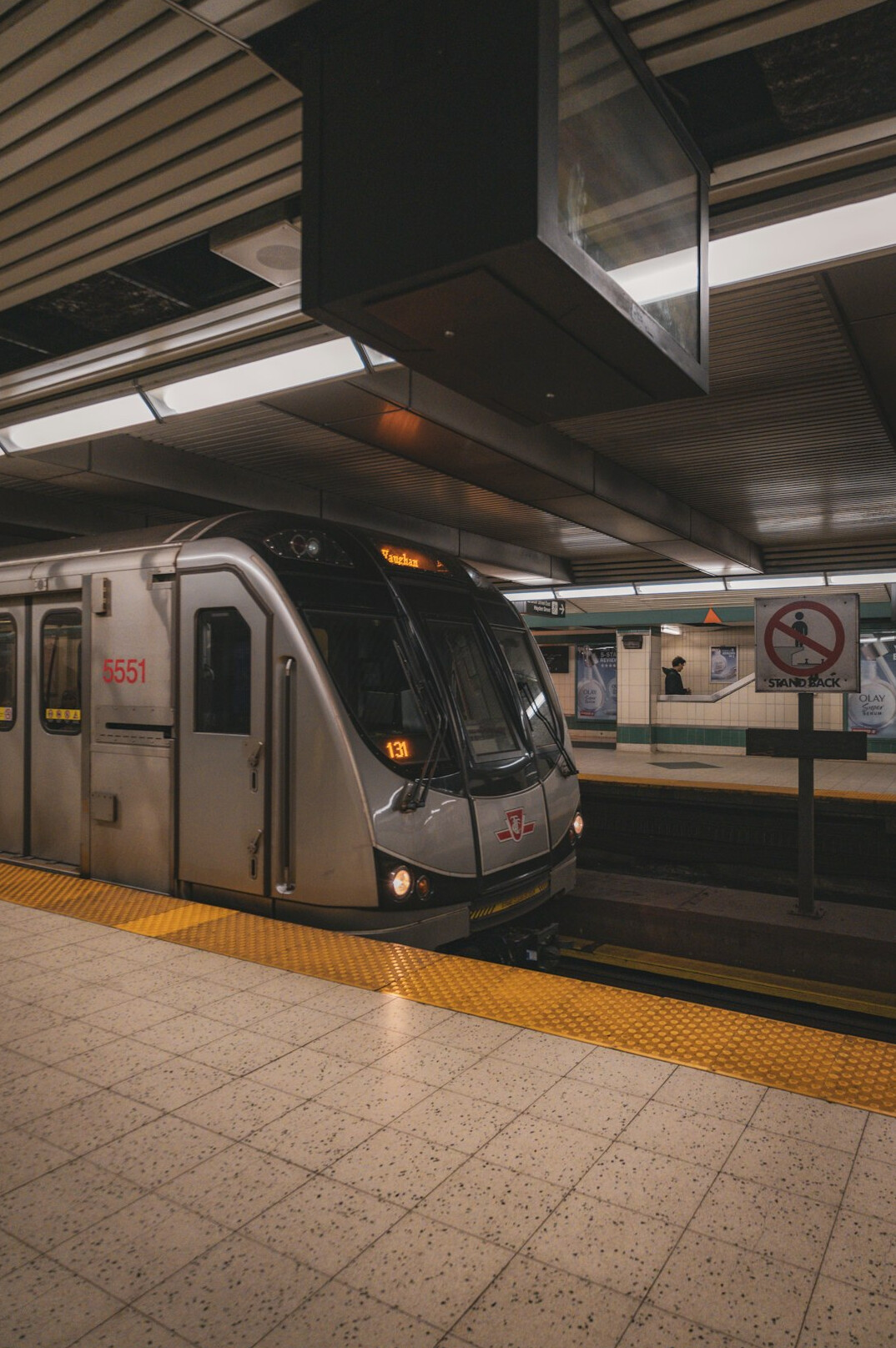 Empty subway platform in a Canadian city bathed in cool morning light