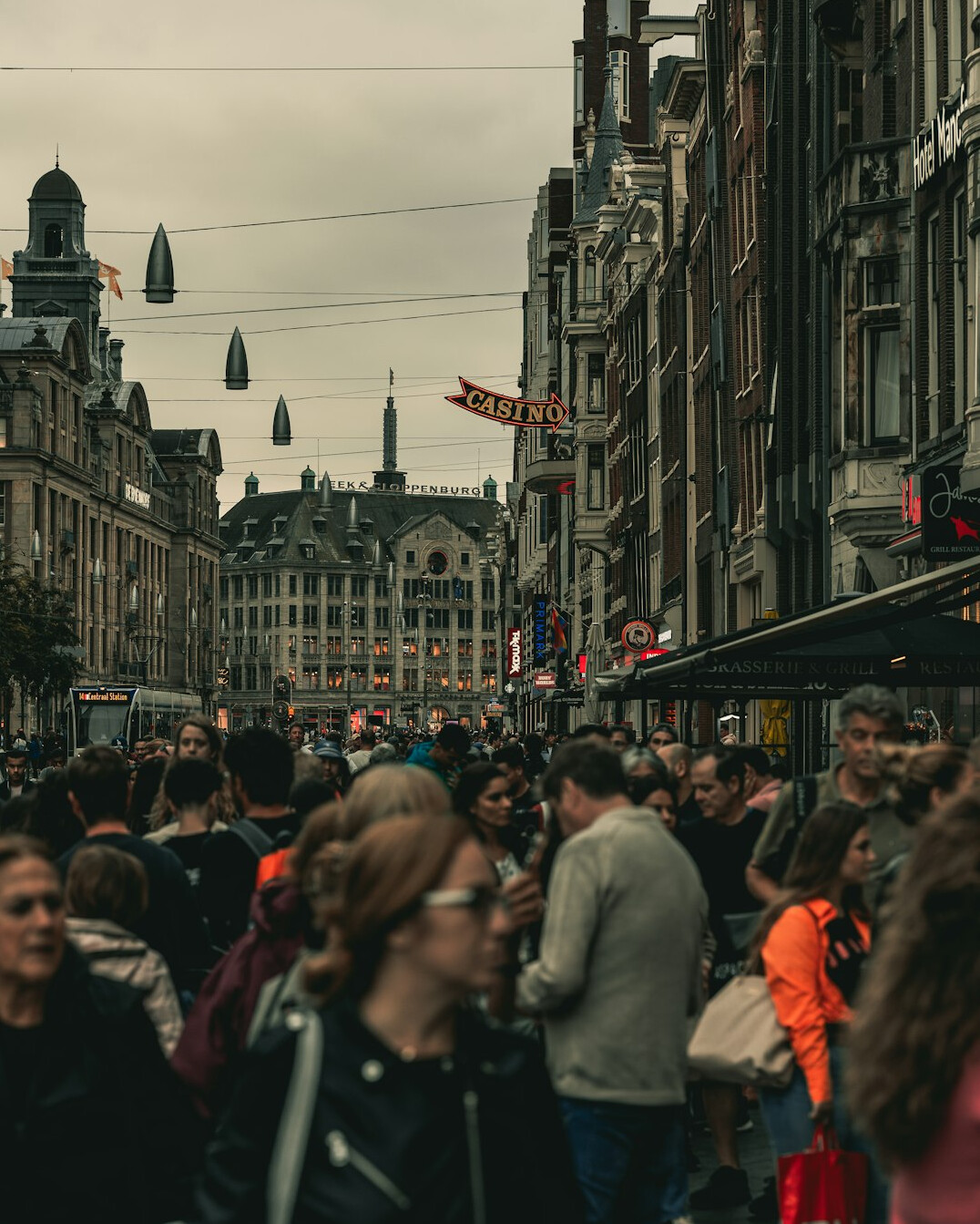 crowd of people walking on busy street
