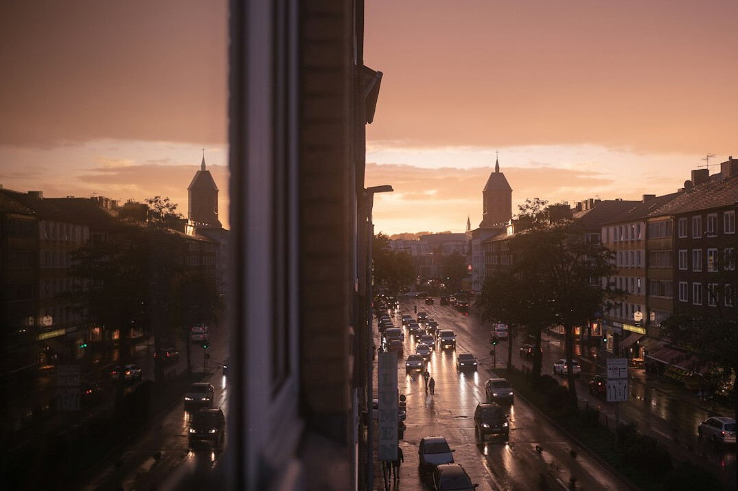 crowded city street at dawn